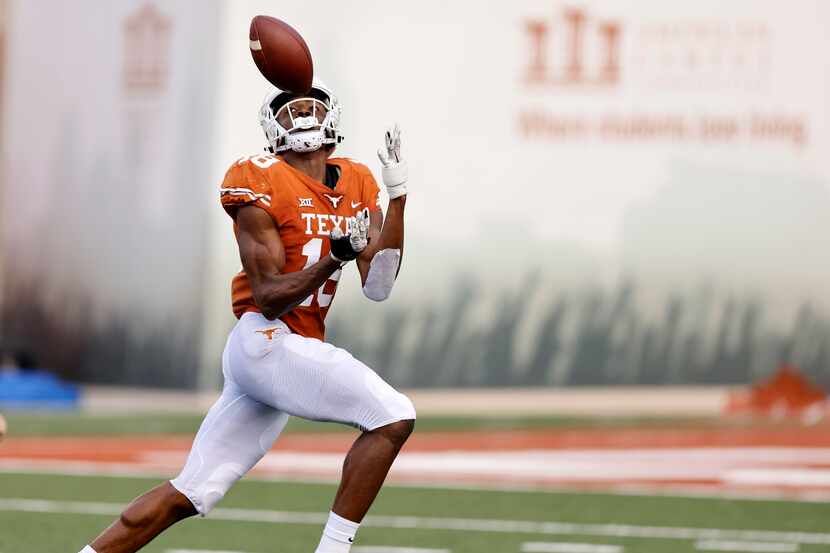 Texas Longhorns wide receiver Isaiah Neyor (18) hauls in a touchdown pass from quarterback...
