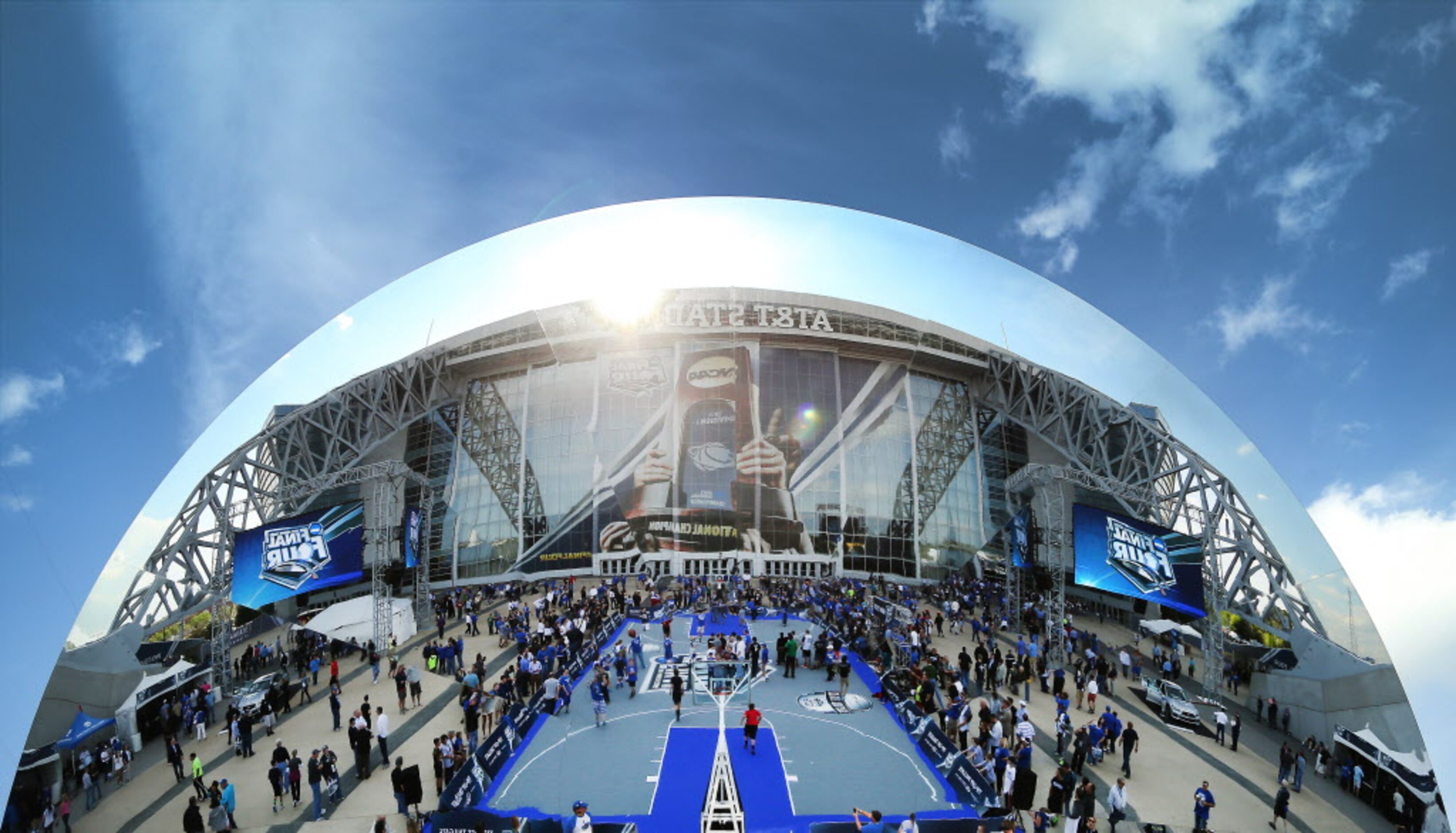 The main court and stadium are seen reflected in a large reflective plate at the Tip-Off...