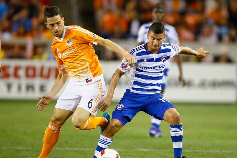 HOUSTON, TX - MARCH 12:  David Rocha #6 of the Houston Dynamo battles for the ball with...