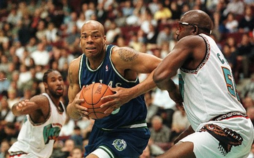 ORG XMIT: S0323041942_WIRE Dallas Mavericks' center Sean Rooks (45) drives for the hoop past...