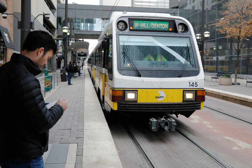 Dallas Morning News reporter Brendan Meyer waited to board the train at the DART Pearl...