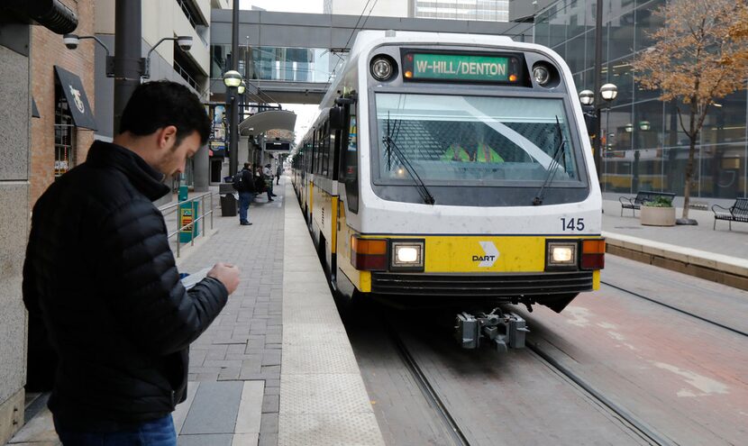 Dallas Morning News reporter Brendan Meyer waited to board the train at the DART Pearl...