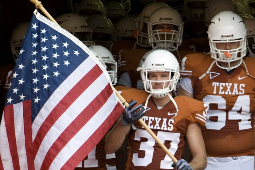Nate Boyer (37) waits to lead the Longhorns football team onto the field before a game...