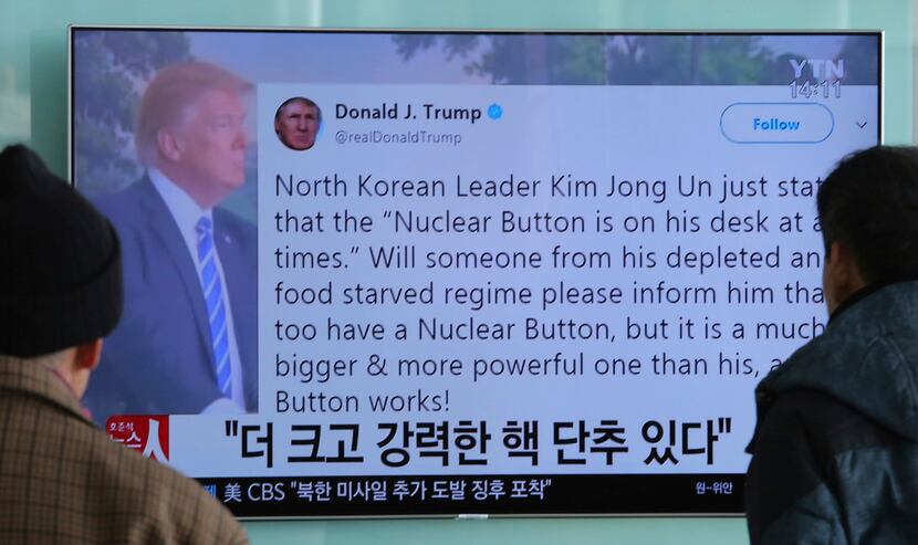 South Koreans watch a new report at Seoul Railway Station on Jan. 3, 2018, after President...