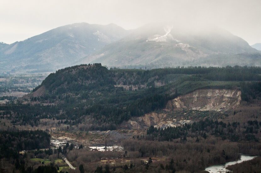 An aerial view shows a chunk of earth missing from the side of the hill facing the...