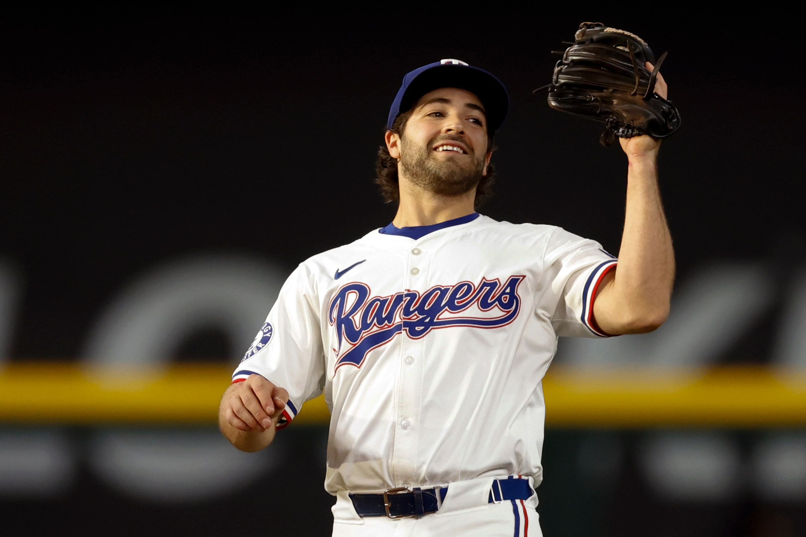 Texas Rangers shortstop Josh Smith (8) catches a fly ball during the second inning against...