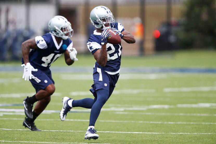 Dallas Cowboys cornerback Jourdan Lewis (27) catches the ball in a drill in rookie minicamp...