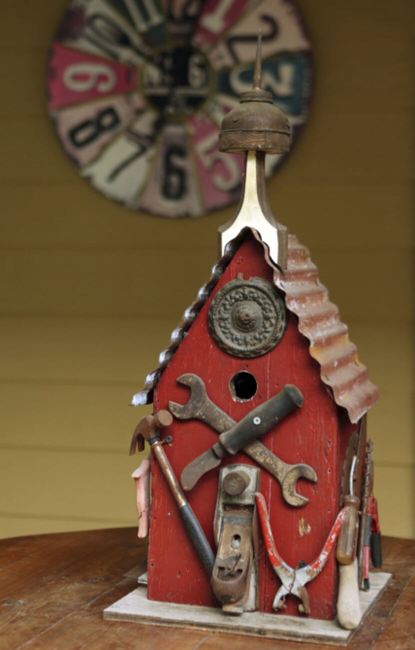 One of the many birdhouses in the backyard of Suzy and Rob Renz's home in Dallas on Friday,...