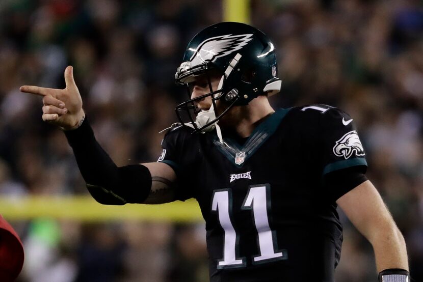 Philadelphia Eagles' Carson Wentz reacts after scoring a touchdown during the first half of...