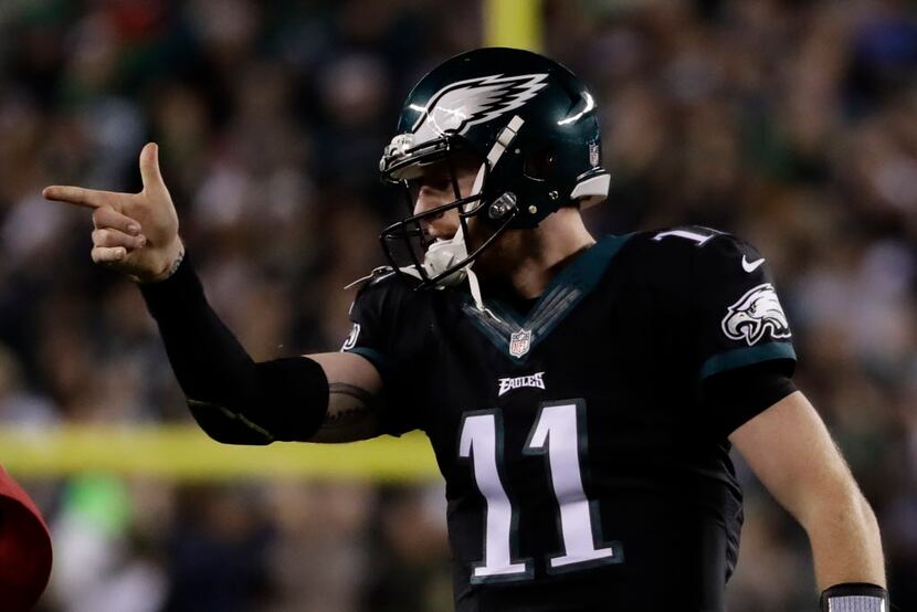 Philadelphia Eagles' Carson Wentz reacts after scoring a touchdown during the first half of...