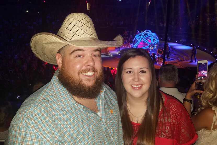 Drew Bargsley of Hurst poses with his girlfriend Chelsea Townsend at the Garth Brooks...