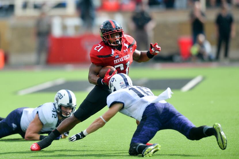 LUBBOCK, TX - SEPTEMBER 26: DeAndre Washington #21 of the Texas Tech Red Raiders tries to...