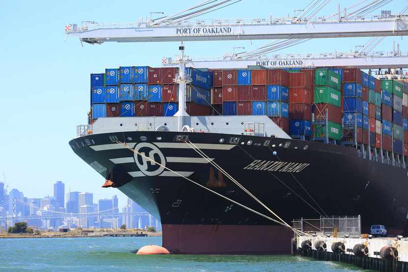 A ship docks at the Port of Oakland, Calif. A wide range of experts agrees that President...