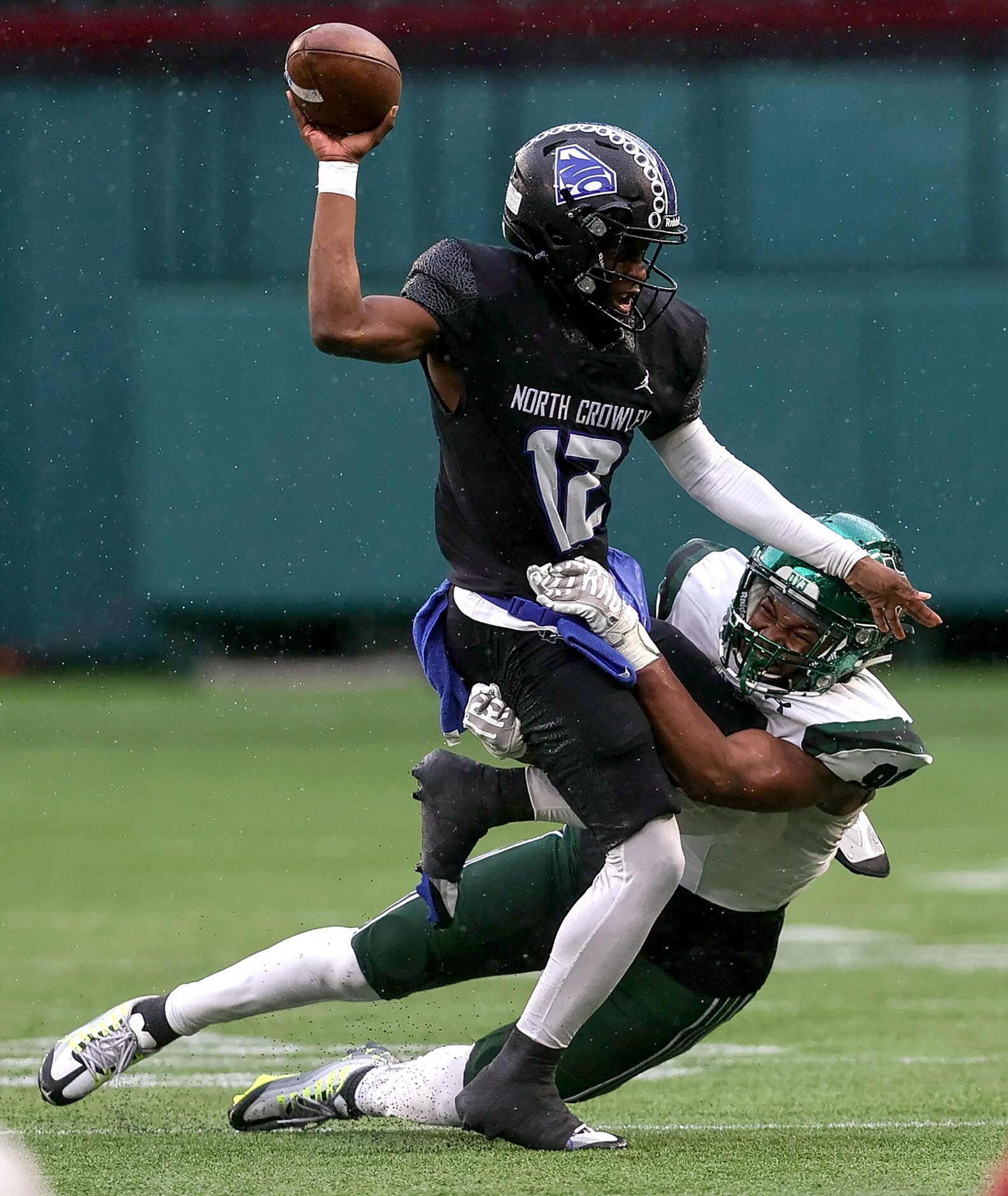 North Crowley quarterback Chris Jimerson (12) tries to get a throw off against Prosper...