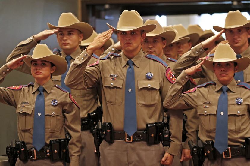 Members of the 155th trooper training class salute during the Texas Department of Public...