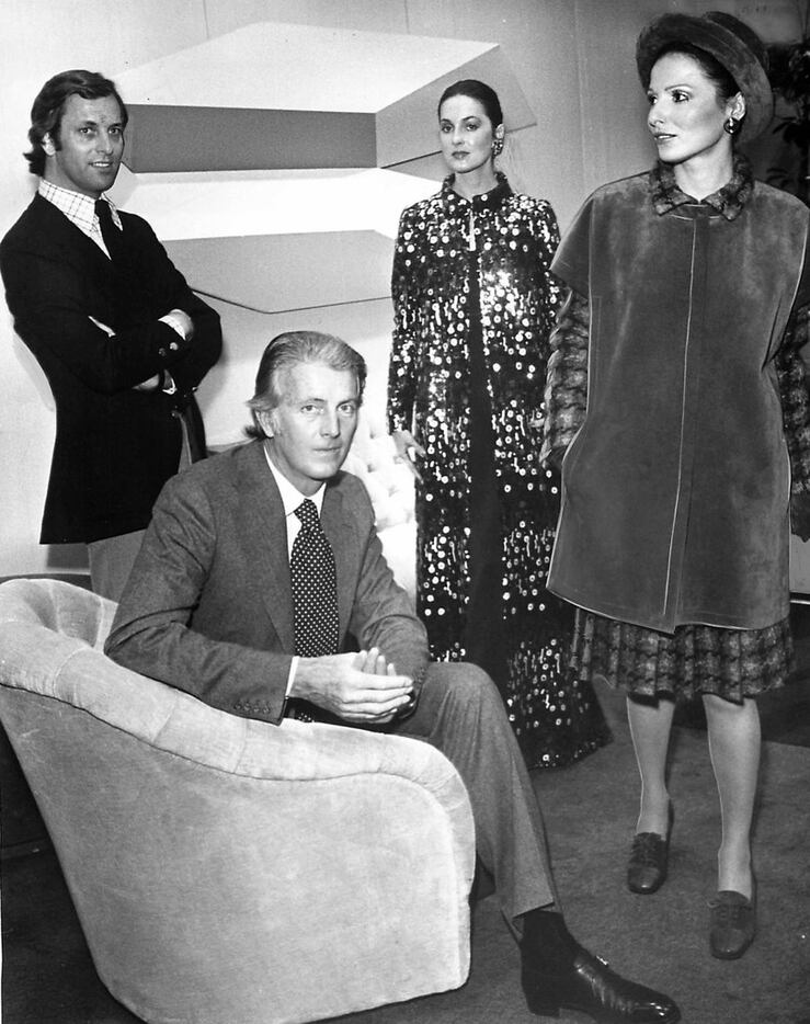A French Fortnight honor guest, fashion designer Hubert De Givenchy, seated, and his...