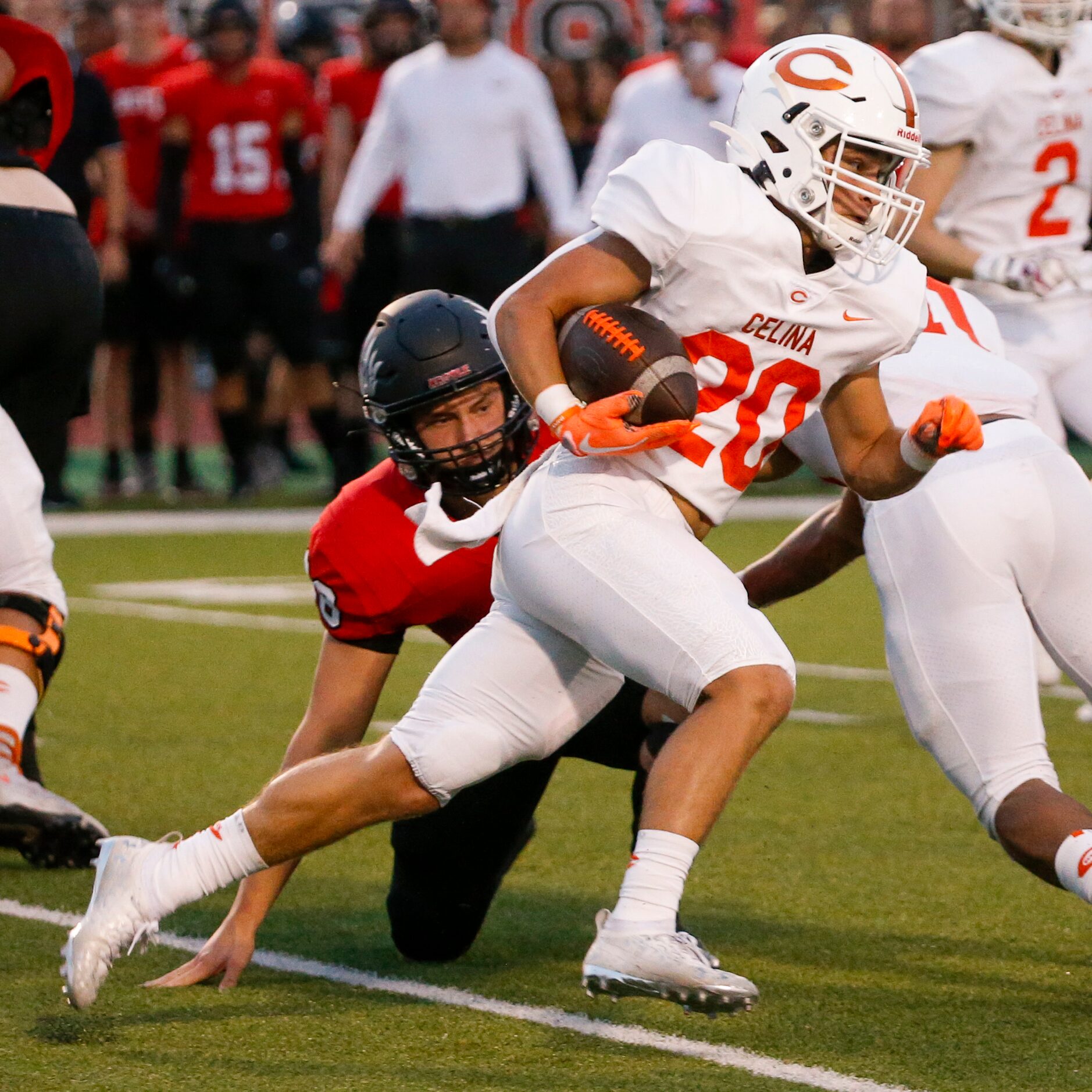 Celina running back Sean Rabe (20) runs past Argyle linebacker Carson Shaw (28) during the...