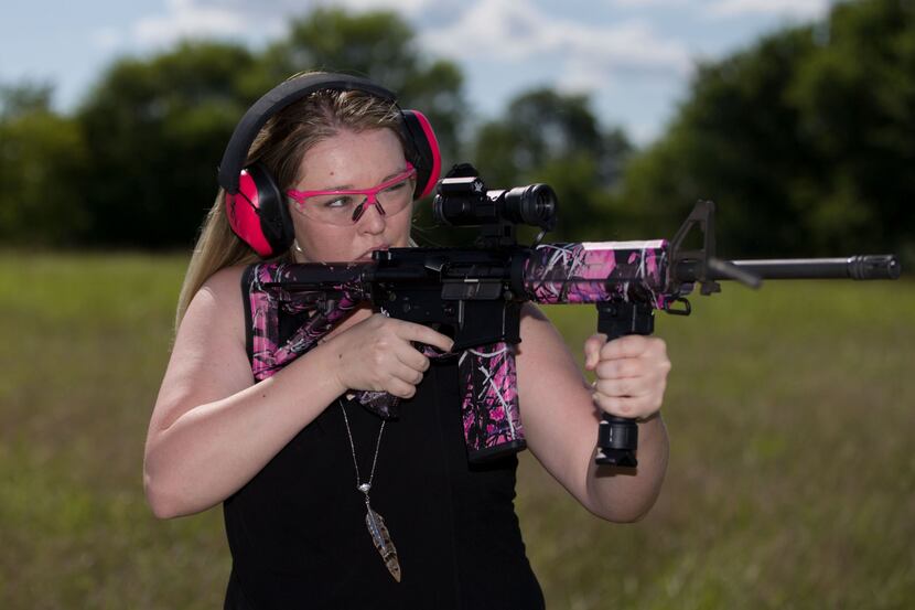 Daley Laurel of Blue Ridge, Texas shoots at a target with her Olympic Arms AR-15 with...