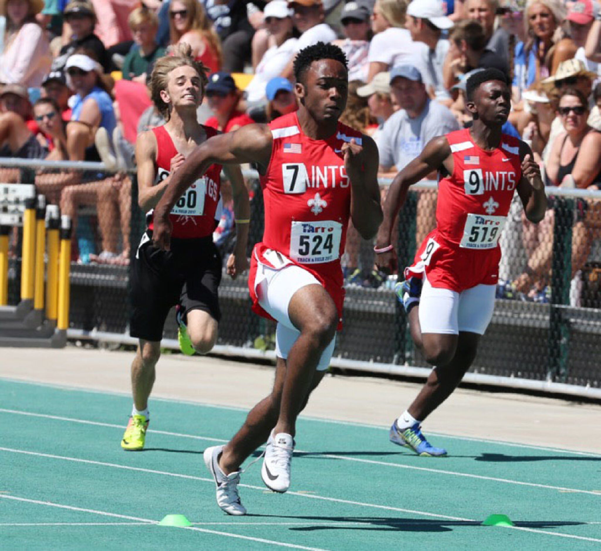 First Baptist's Erik Rogers, center, places first in the 2A mens 100 meter dash at the TAPPS...