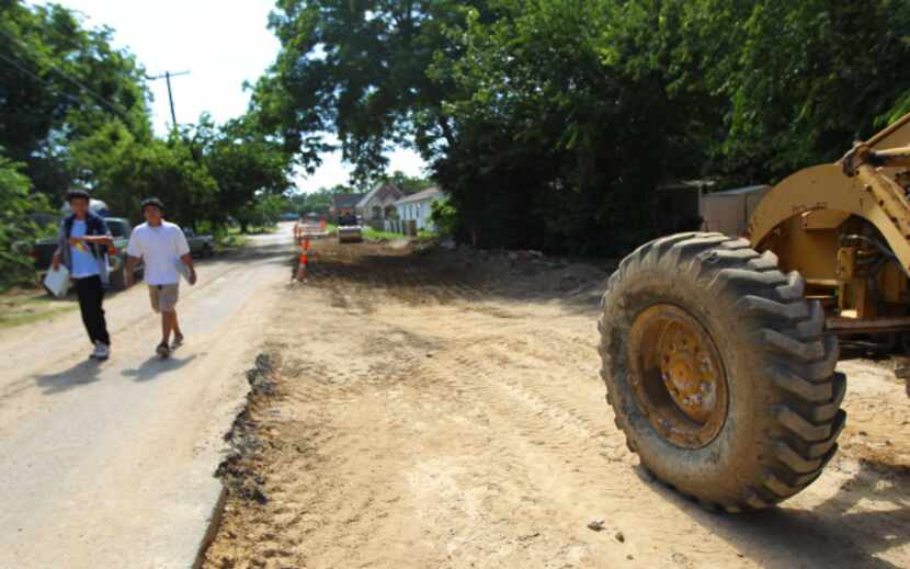 Street repairs and new construction are happening all over the West Dallas neighborhood near...