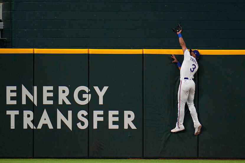 Texas Rangers center fielder Leody Taveras catches a fly ball by Houston Astros' Yordan...