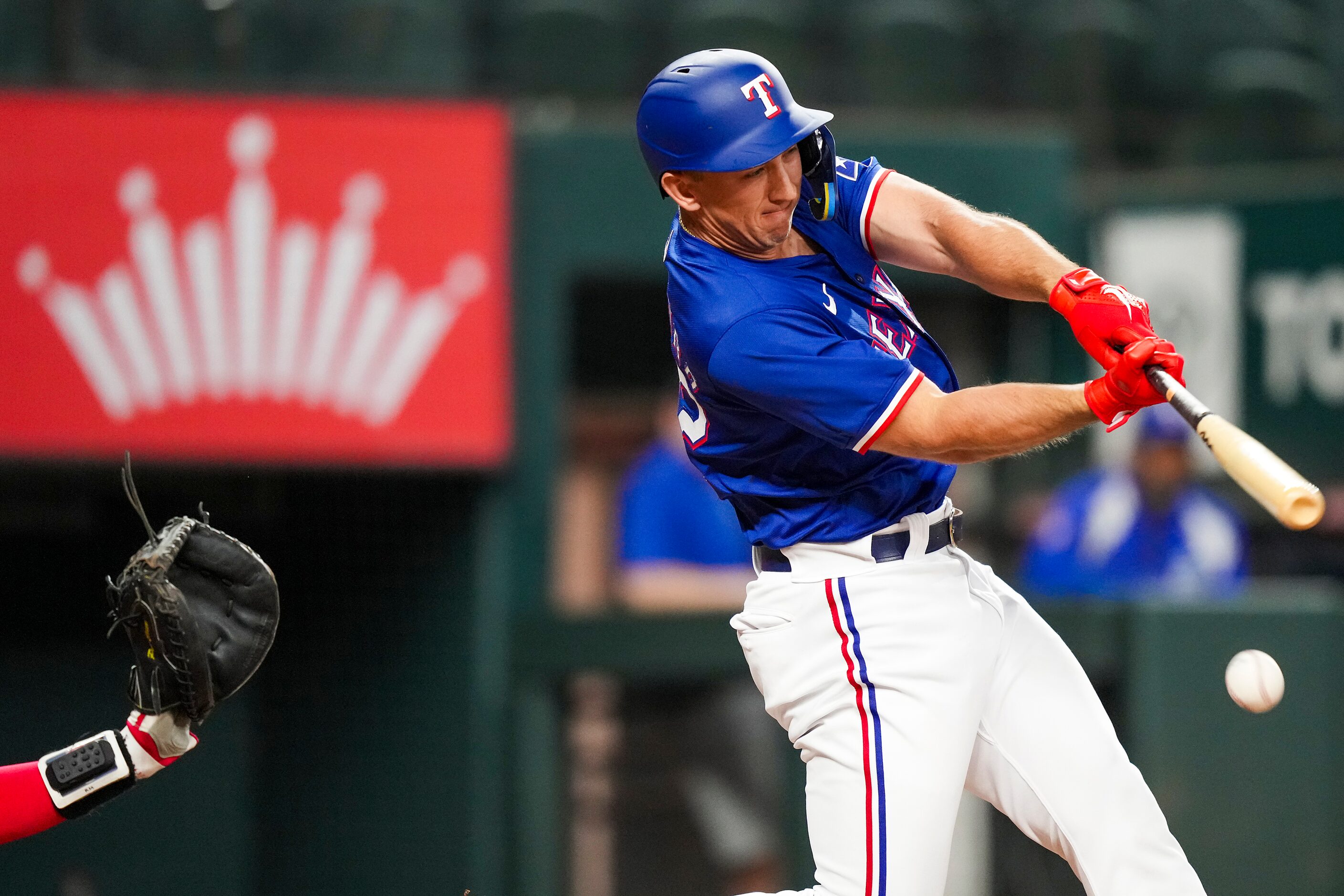 Texas Rangers designated hitter Wyatt Langford hits a grounder during the second inning...