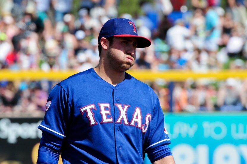 Mar 22, 2015; Peoria, AZ, USA; Texas Rangers third baseman Joey Gallo (70) looks on during...