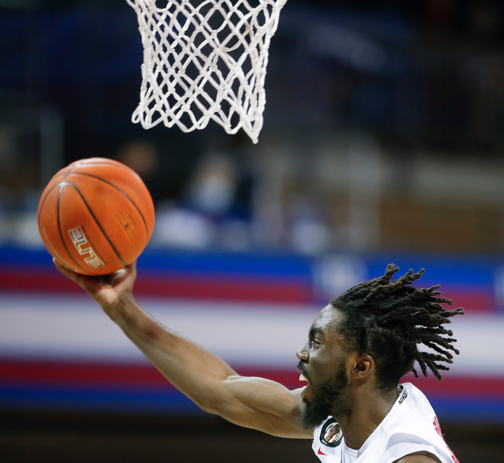 SMU guard Emmanuel Bandoumel (5) attempts a layup during the second half of a college...