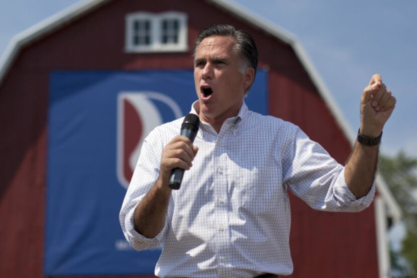 A man interrupted Republican presidential candidate Mitt Romney during a speech in...
