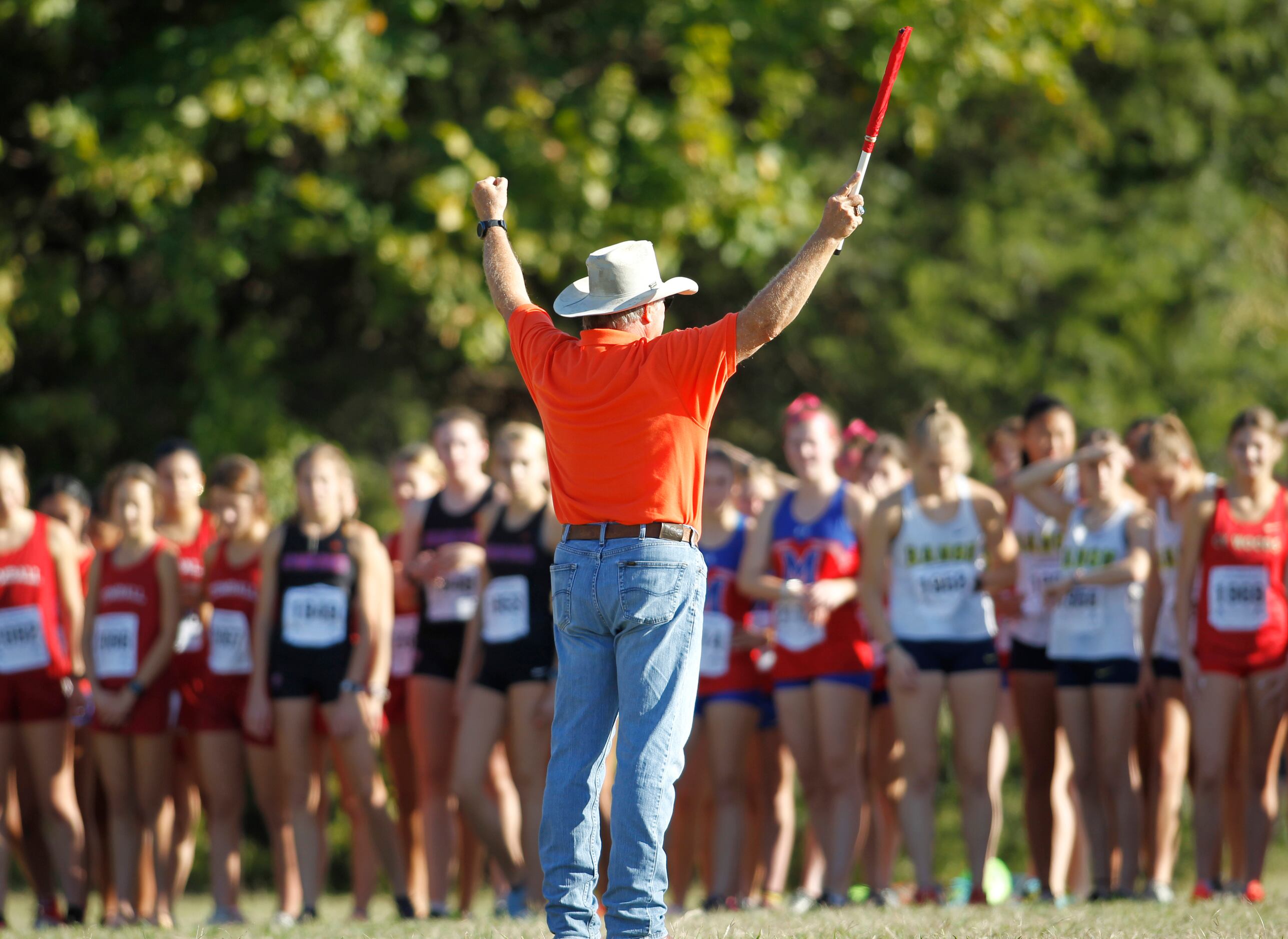A race official gives final instructions prior to the start of the girls race. The Class 6A...