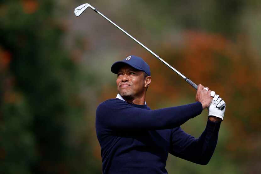 Tiger Woods hits from the fourth tee during the first round of the Genesis Invitational golf...