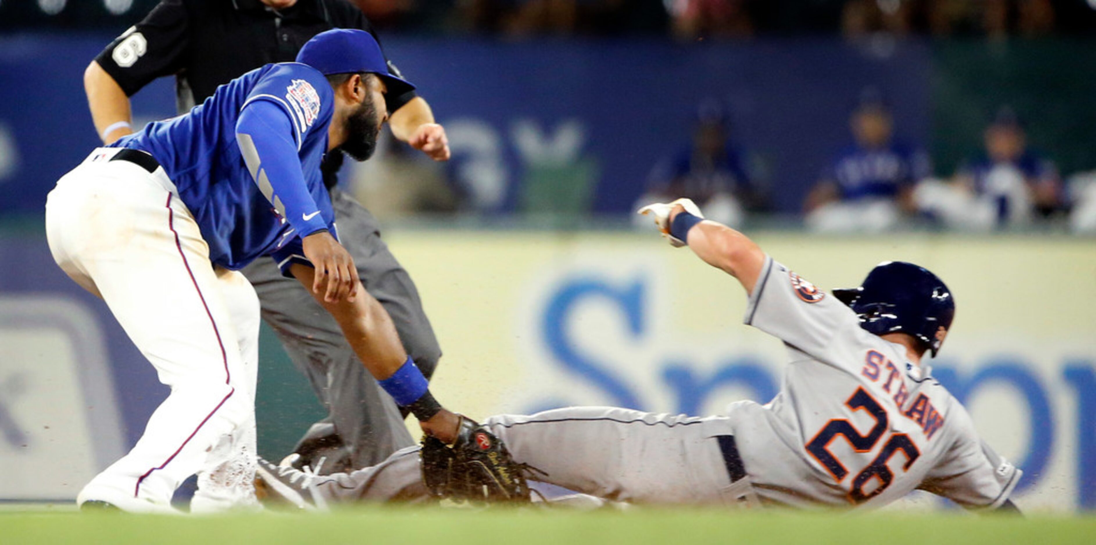 Texas Rangers shortstop Elvis Andrus (1) completes the double play, tagging Houston Astros...