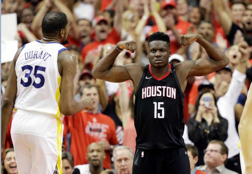 Houston Rockets center Clint Capela (15) celebrates after he scored against Golden State...