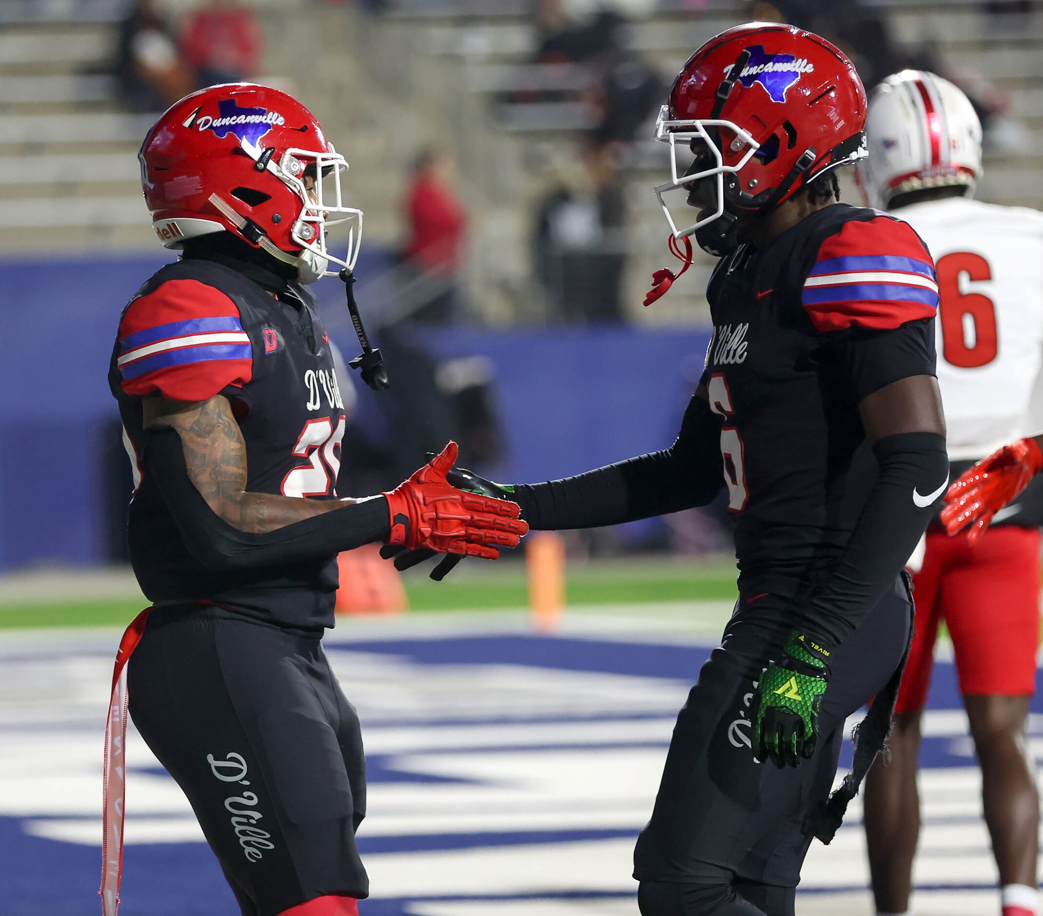 Duncanville running back Caden Durham (left) celebrates with Ja'Meir Willis (right) after...