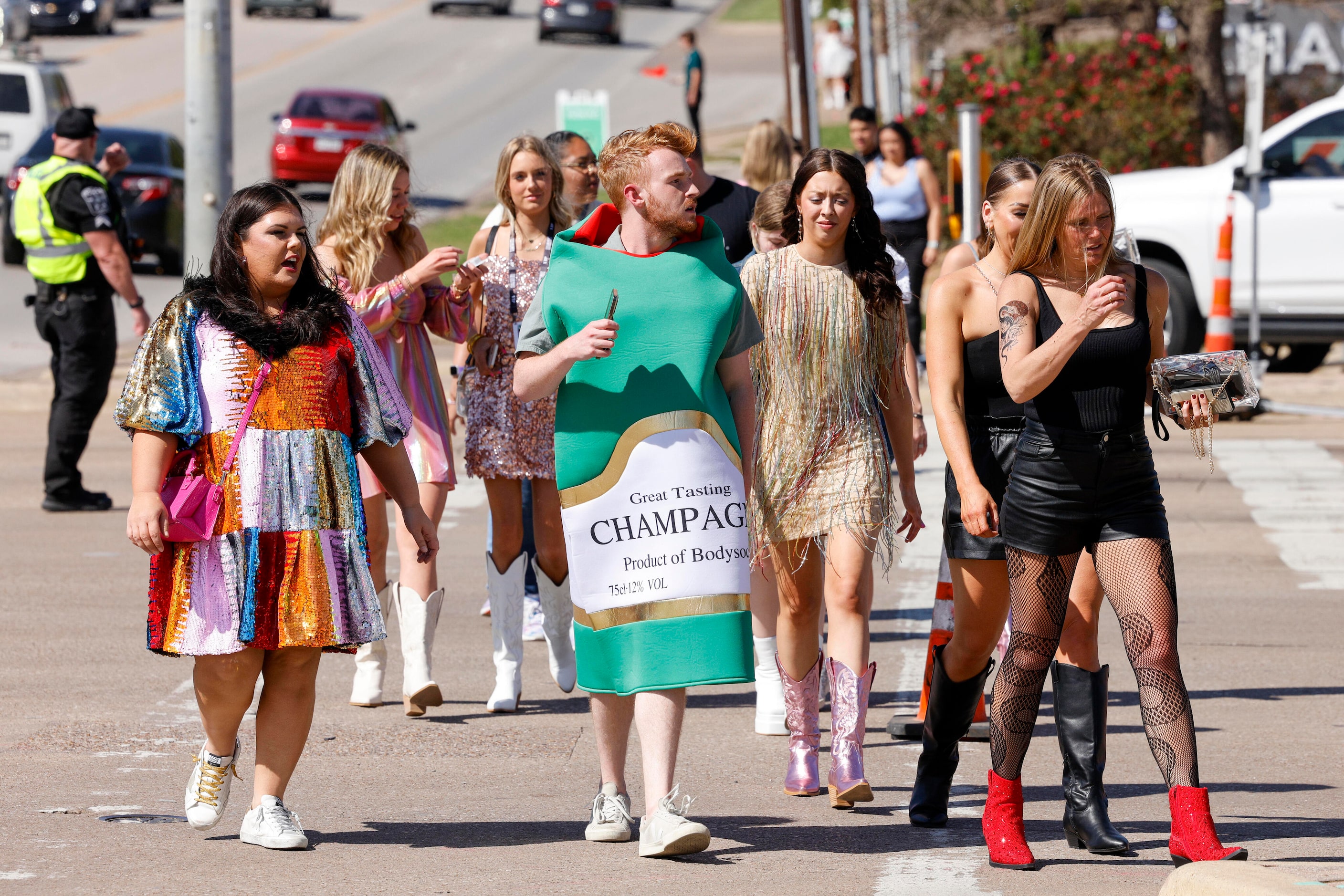 Fans cross Randol Mill Road before a Taylor Swift Eras Tour concert at AT&T Stadium on...