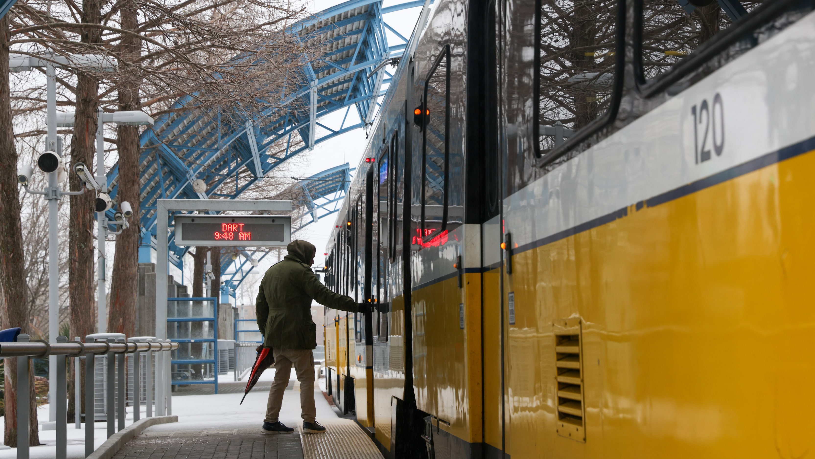 Dallas resident Austin Waldrop gets on a Dallas Area Rapid Transit train at White Rock...