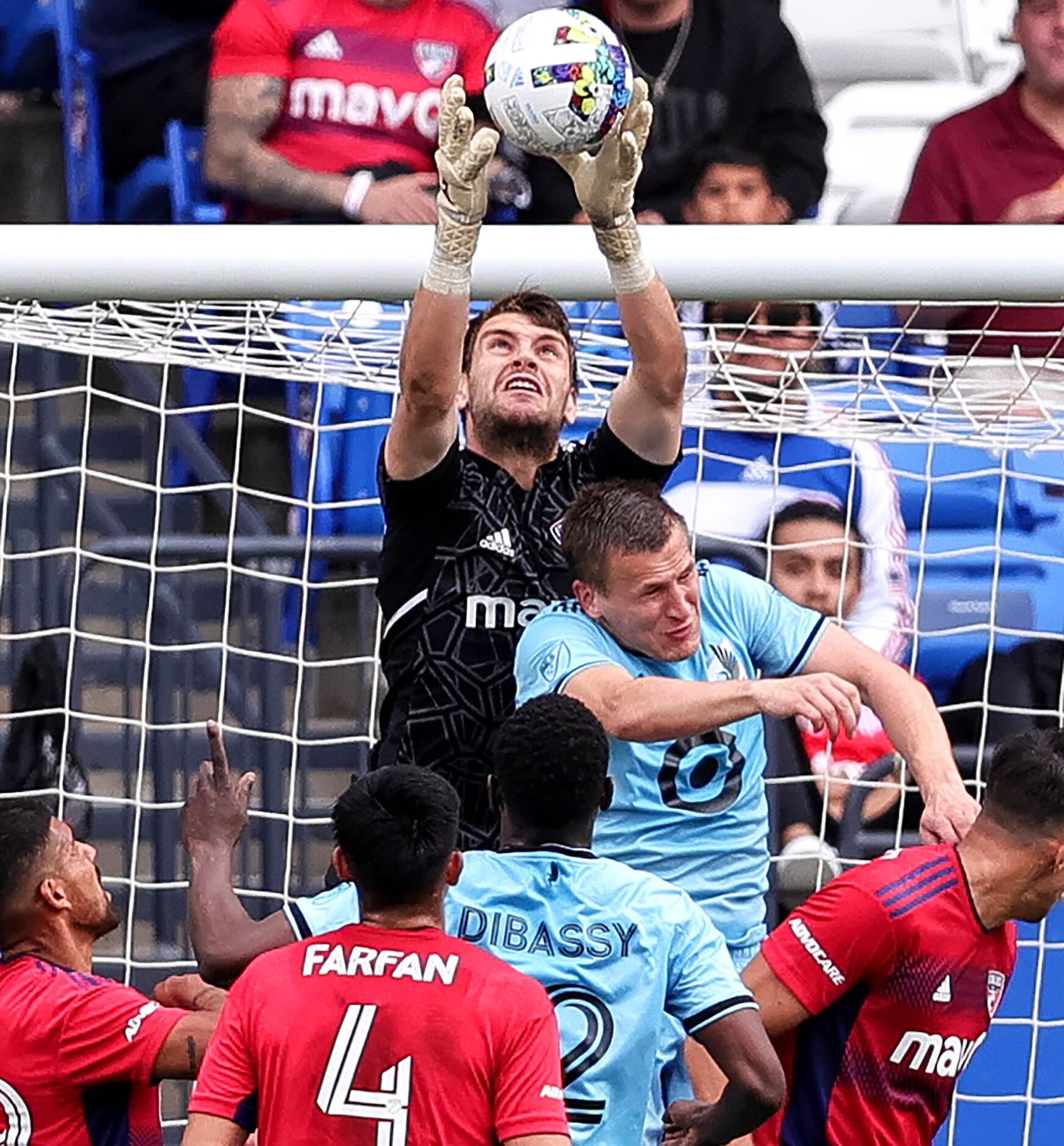 FC goalkeeper Maarten Paes goes up to make a save against Minnesota United during the first...