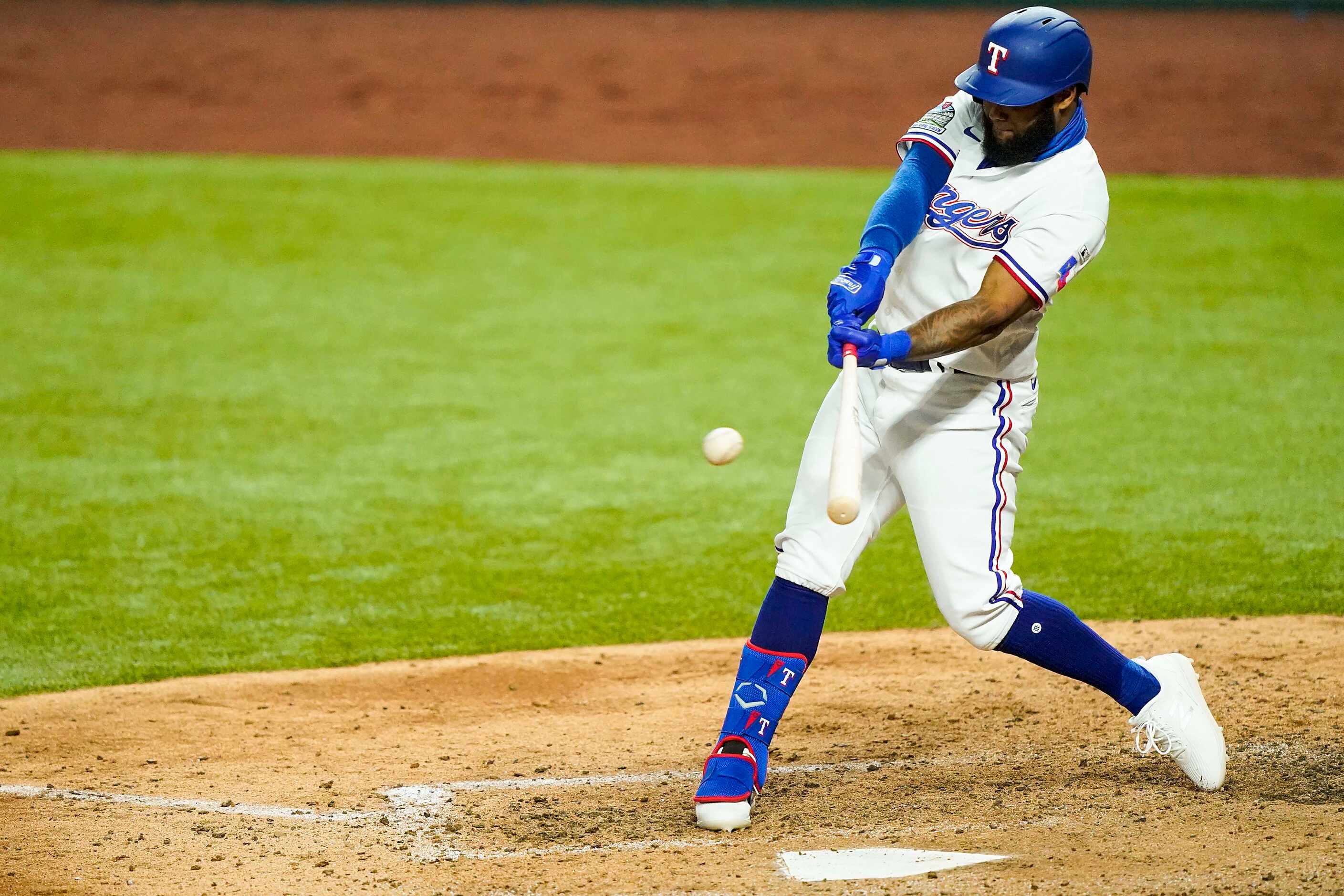 Texas Rangers outfielder Danny Santana connects for a double, the first Rangers hit at the...