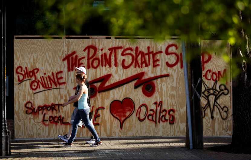 The Point Skate Shop in Deep Ellum has boarded up the front of the store and encouraged...