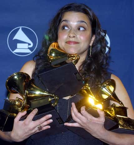 Norah Jones holds up her five Grammy Awards during the 45th annual Grammy Awards on Feb. 23,...