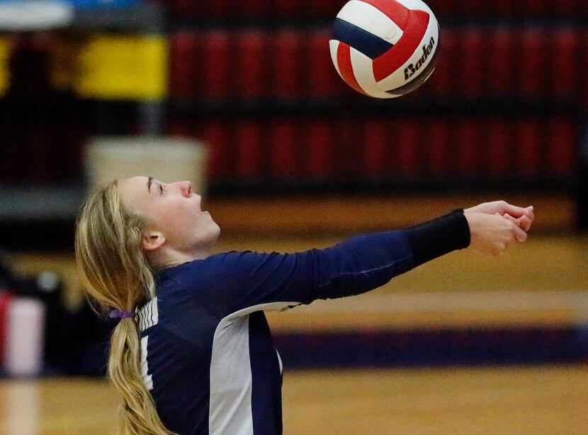 Flower Mound High School setter Avery Miller (4) makes a save during game one as McKinney...