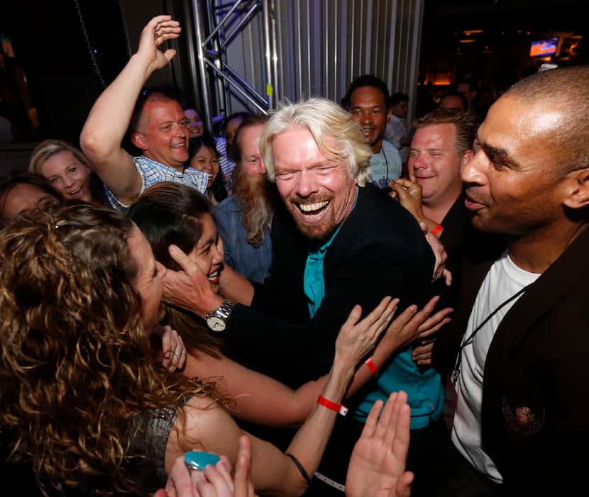 Sir Richard Branson greeted Lin Domingo after crowdsurfing at The Rustic.