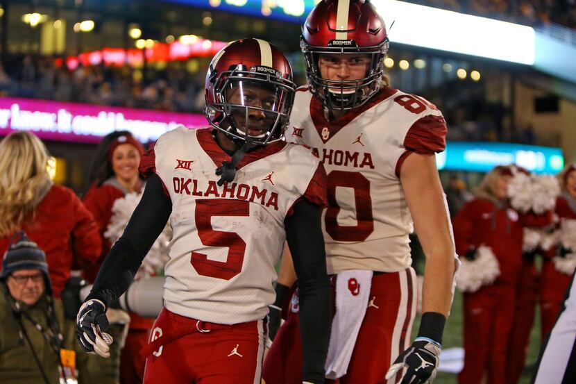 MORGANTOWN, WV - NOVEMBER 23:  Marquise Brown #5 of the Oklahoma Sooners celebrates after...