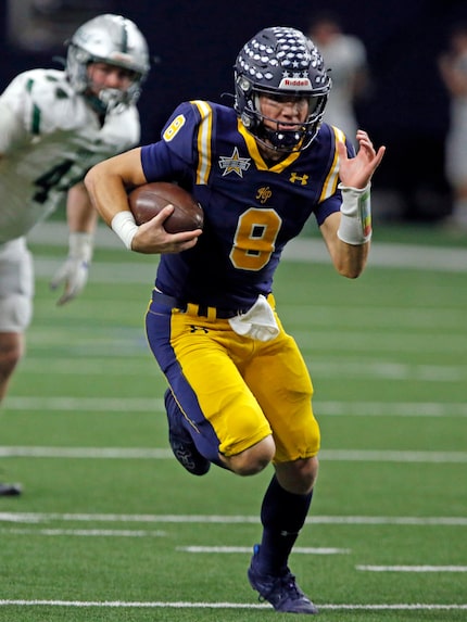 Highland Park High QB Buck Randall (8) runs for a first down during the first half of a high...