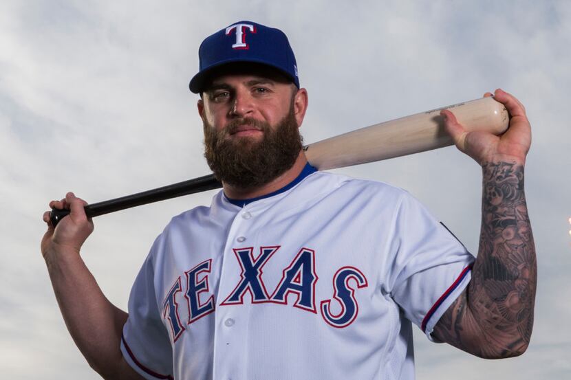 Texas Rangers first baseman Mike Napoli (5) poses for a portrait on photo day during spring...