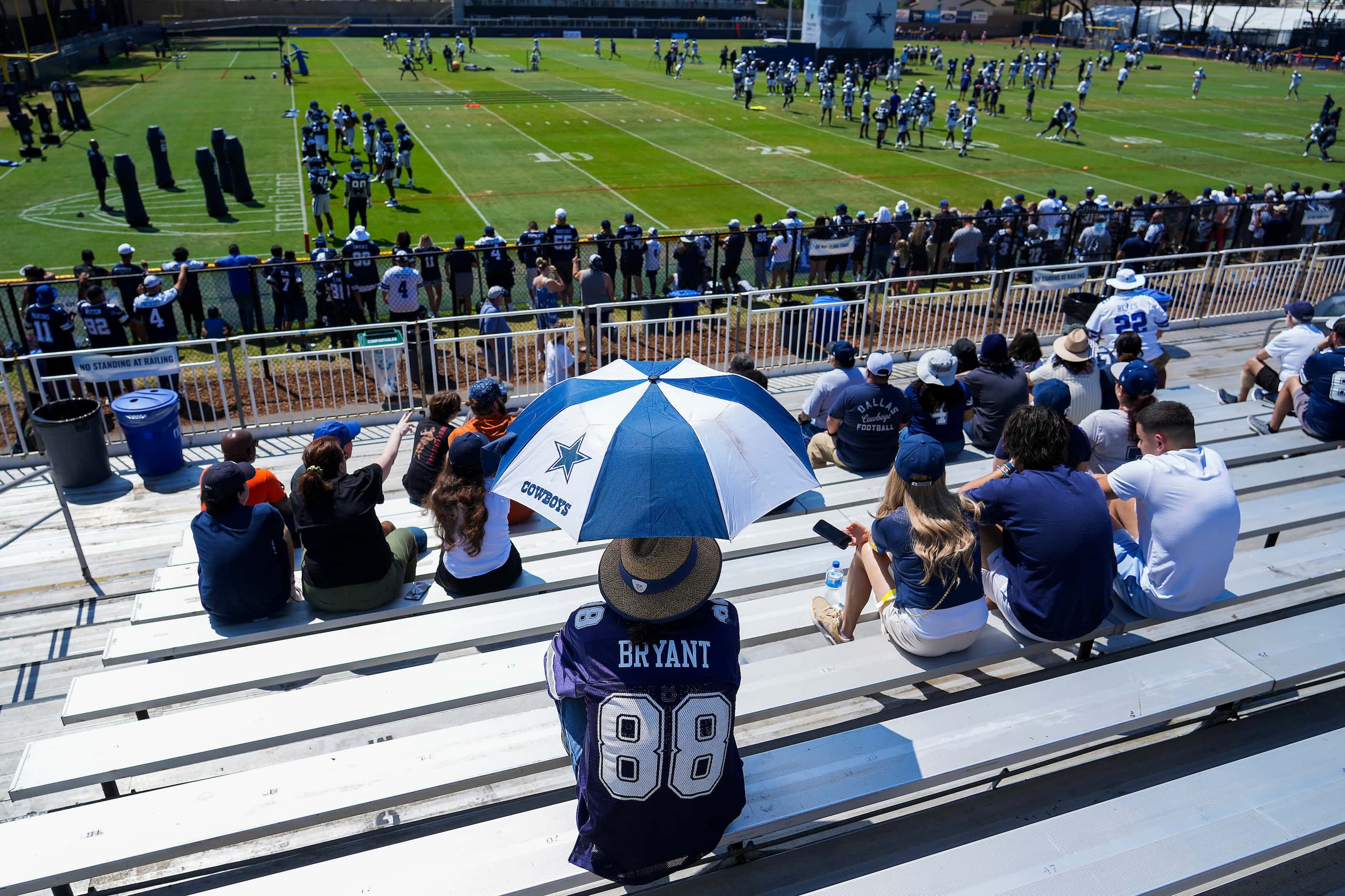 Dallas Cowboys fans watch the team work out during a training camp practice on Tuesday, Aug....