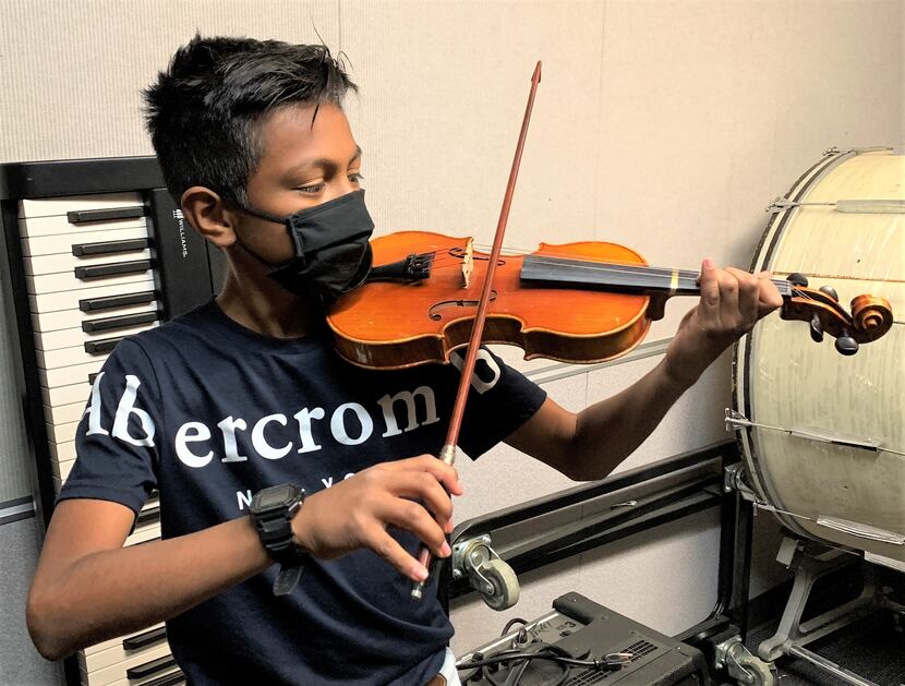 Seventh-grader Damian Resendiz of Greenville Middle School plays violin.