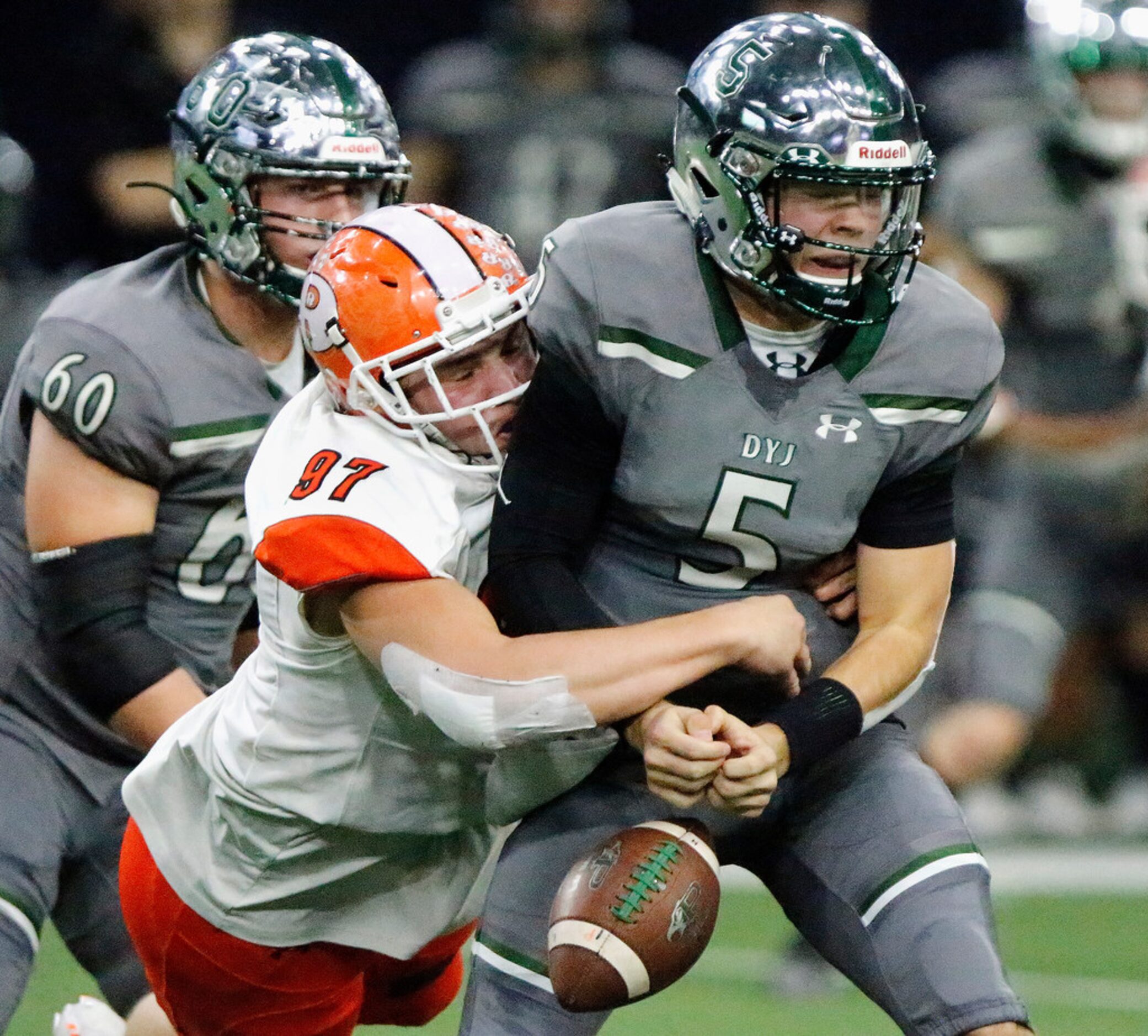 Rockwall High School linebacker Jack Deapen (97) forces a fumble as he hits Prosper High...