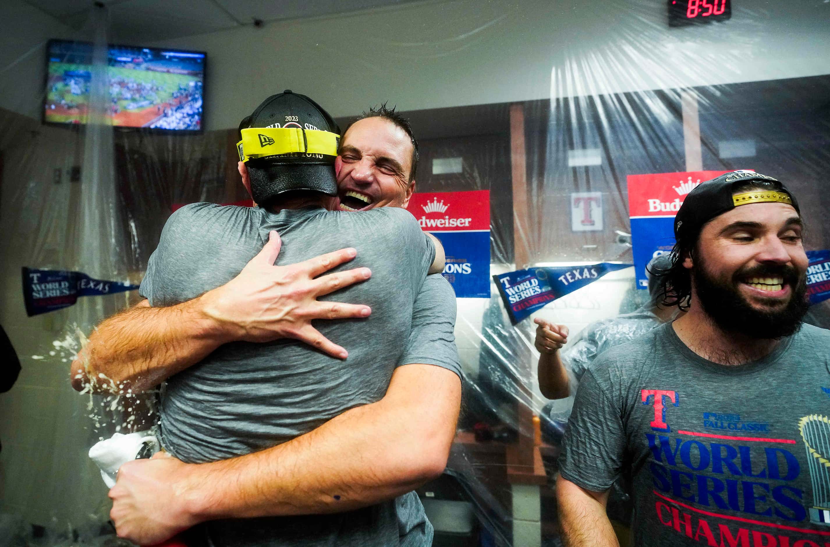 Texas Rangers general manager Chris Young hugs starting pitcher Max Scherzer as Rangers...