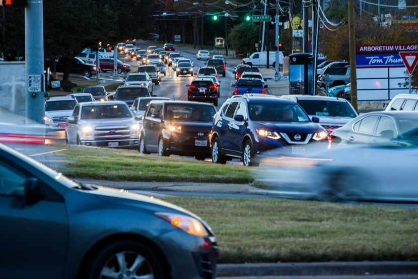 Vehicles drive through the intersection of East Grand Avenue, Garland Road and Gaston Avenue...